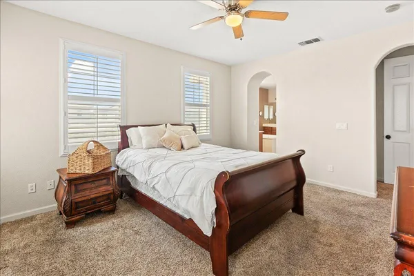 a bedroom with a bed and window