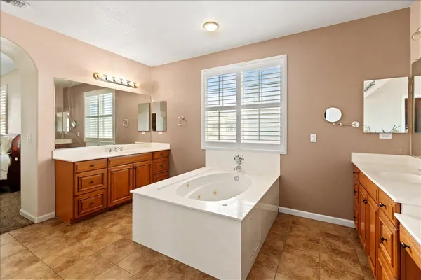 a bathroom with a sink double vanity and a mirror