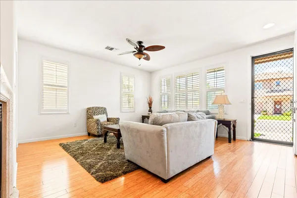 a kitchen with stainless steel appliances kitchen island granite countertop a stove a sink and a microwave