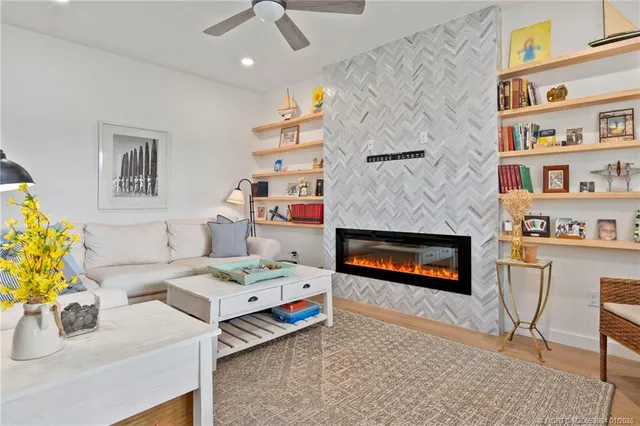 a bedroom with furniture and a fireplace