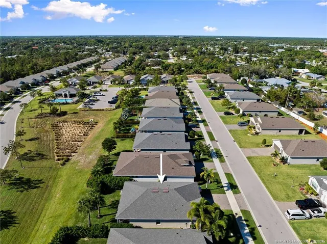 an aerial view of residential houses with outdoor space