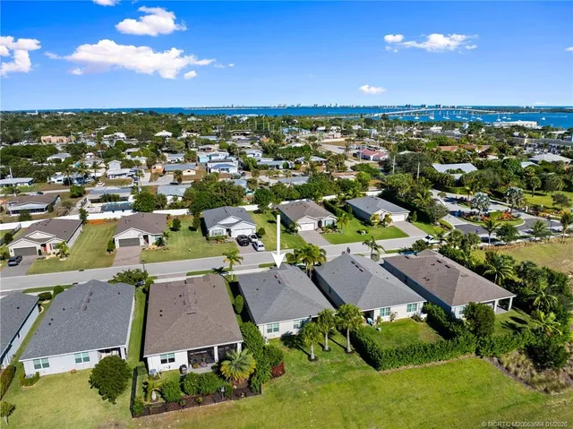 an aerial view of residential houses with outdoor space