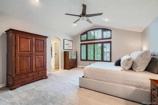 a bedroom with a large bed and window