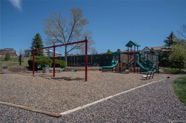 a view of a park with swings