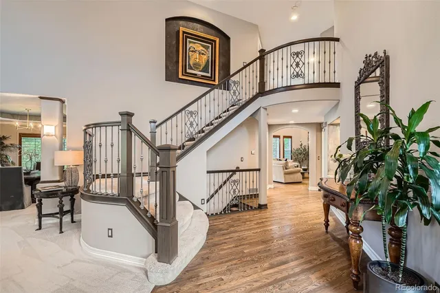 a view of entryway livingroom and hall with wooden floor