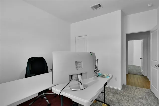 a bathroom with a sink shower and a mirror