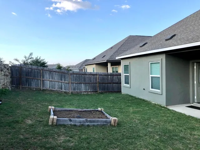 a house view with a garden space