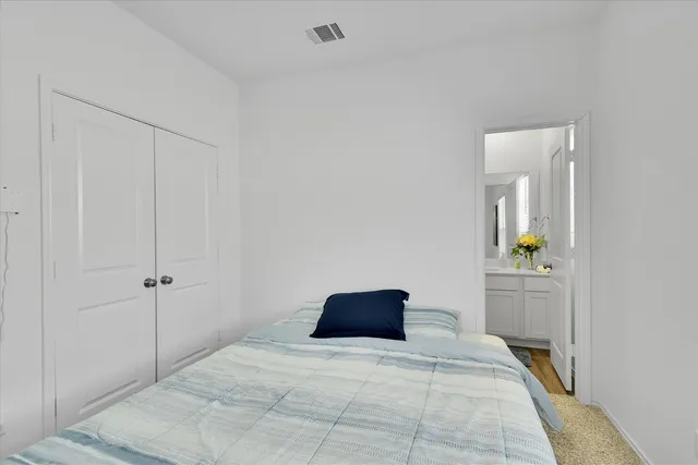 a kitchen with sink a stove and cabinets