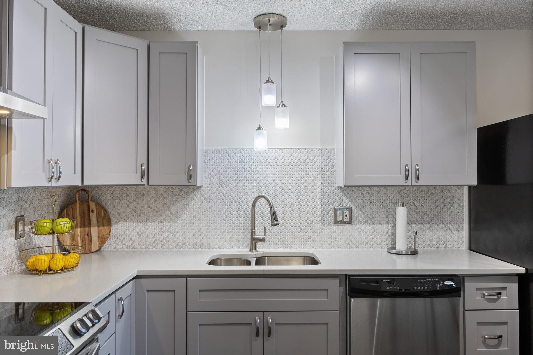 205 East Joppa Road, Unit 2403 Towson, MD 21286 - Photo 15 of 48 a kitchen with a sink and cabinets