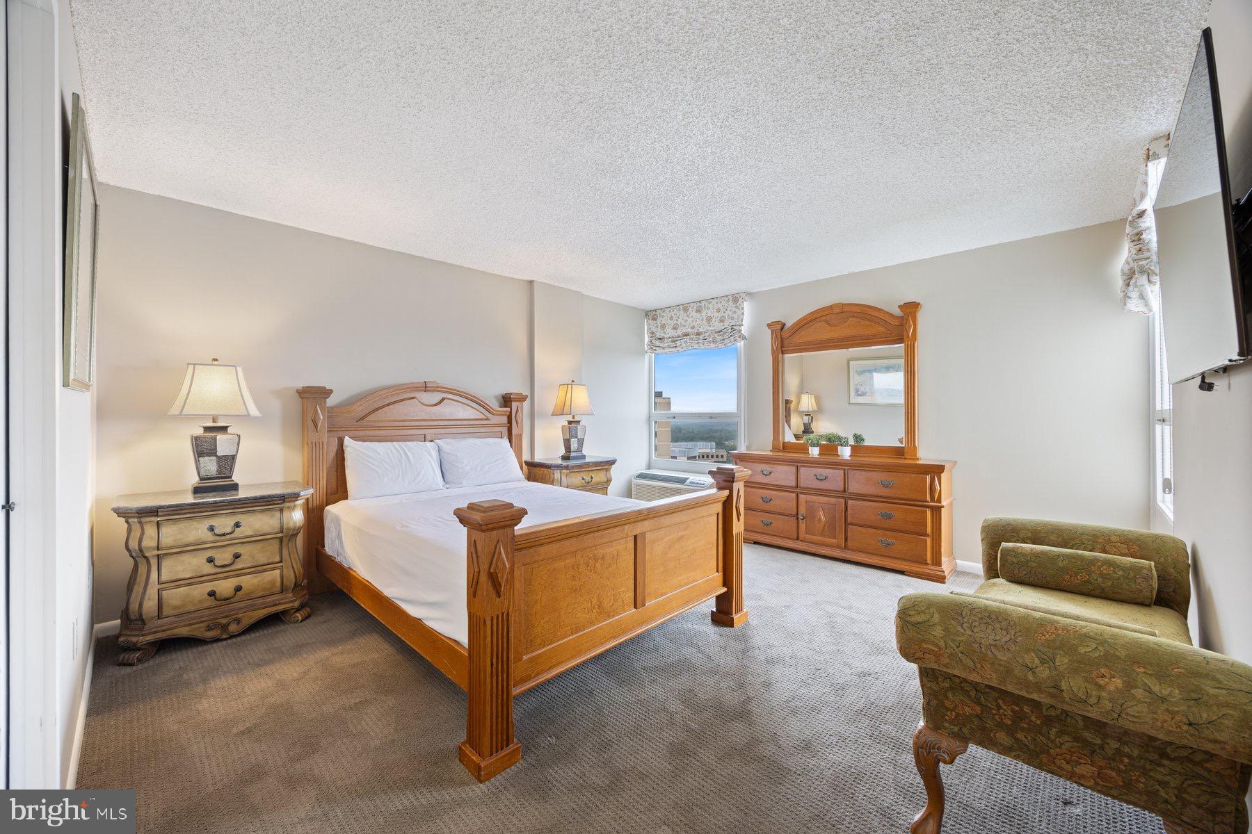 205 East Joppa Road, Unit 2403 Towson, MD 21286 - Photo 21 of 48 a bedroom with furniture and a couch