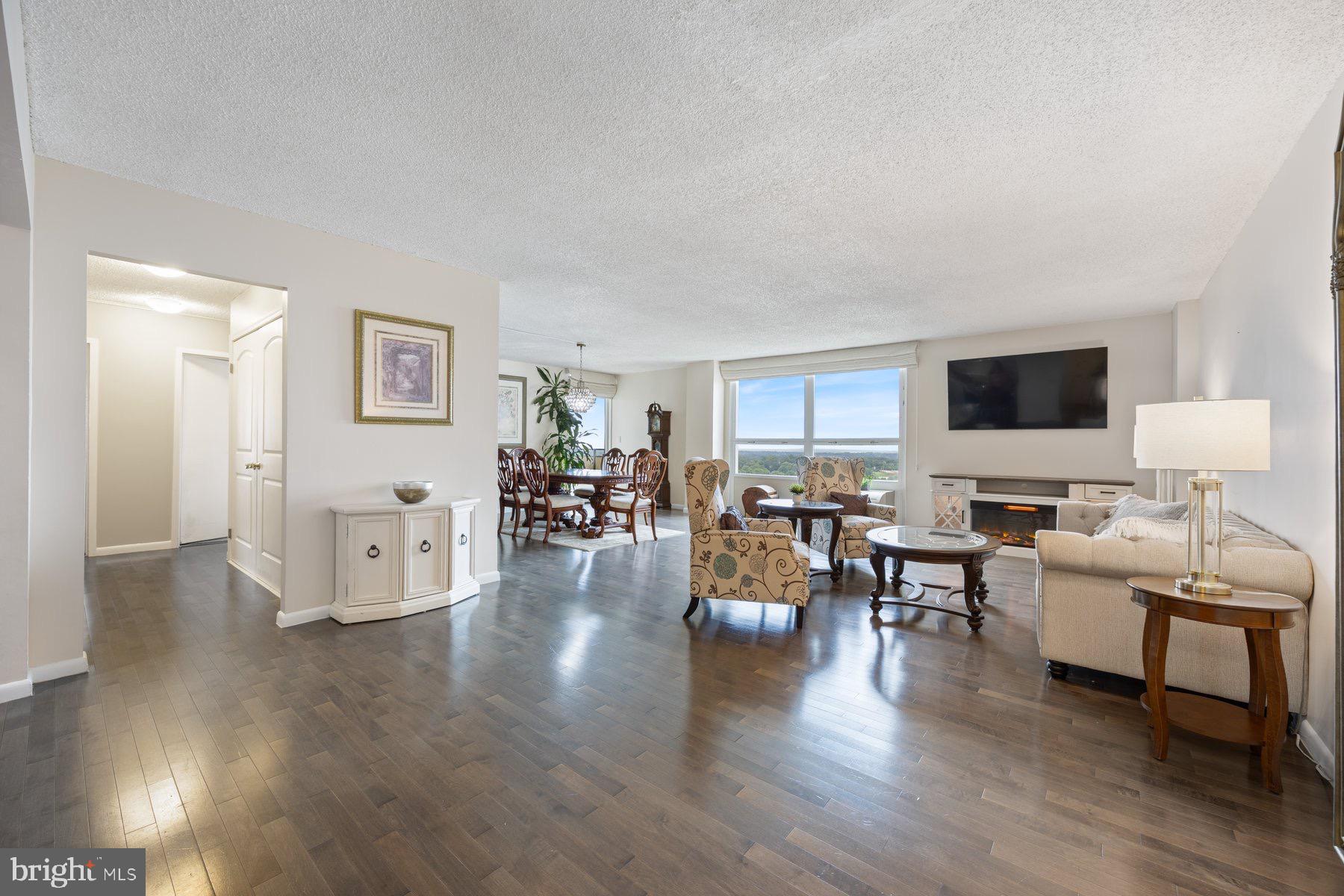 205 East Joppa Road, Unit 2403 Towson, MD 21286 - Photo 3 of 48 a living room with furniture and wooden floor