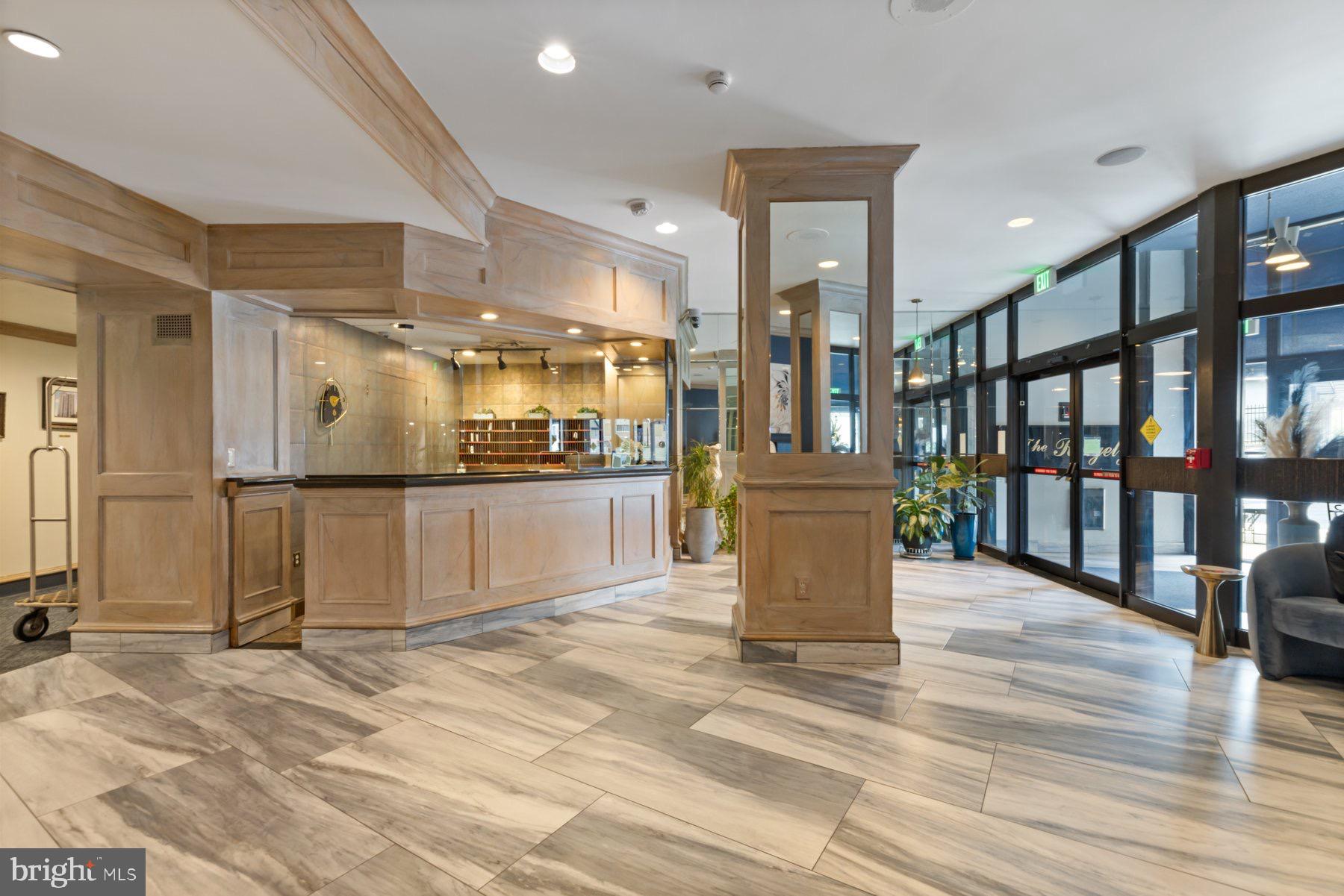 205 East Joppa Road, Unit 2403 Towson, MD 21286 - Photo 33 of 48 a view of a kitchen with stainless steel appliances kitchen island granite countertop a refrigerator stove top oven and cabinets