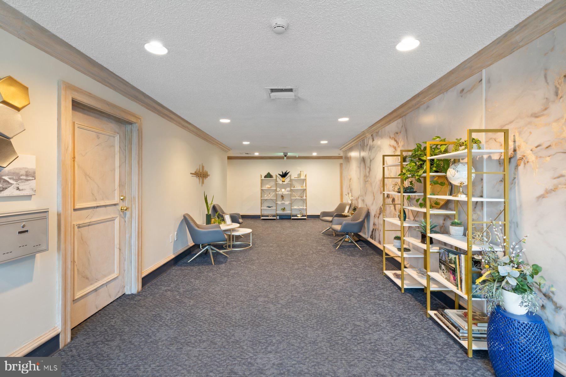 205 East Joppa Road, Unit 2403 Towson, MD 21286 - Photo 37 of 48 a living room with furniture gym equipment and potted plant