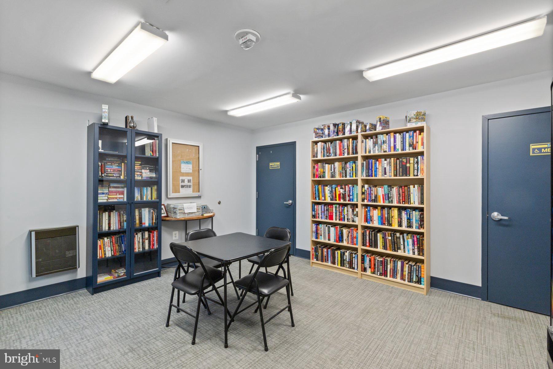 205 East Joppa Road, Unit 2403 Towson, MD 21286 - Photo 38 of 48 a livingroom with a bookshelf and a dining room