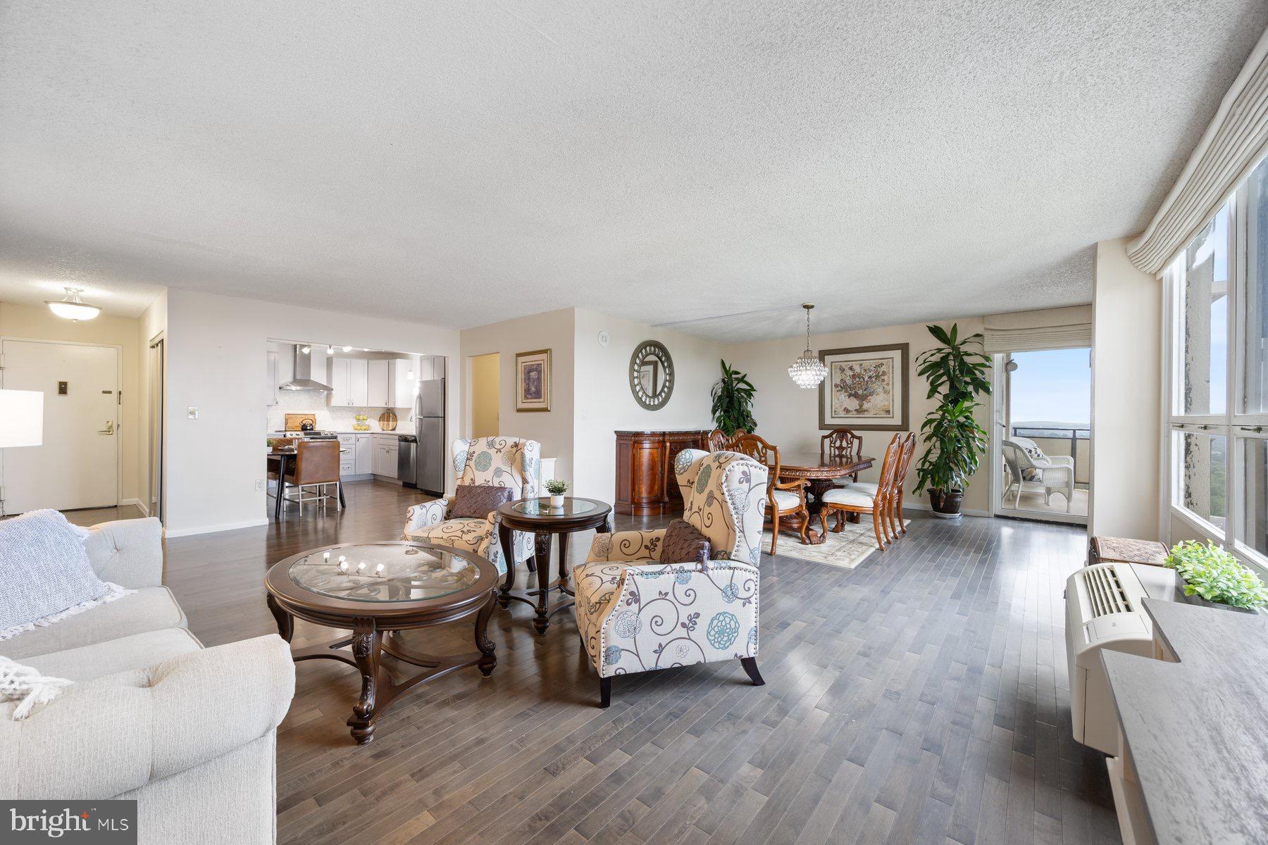 205 East Joppa Road, Unit 2403 Towson, MD 21286 - Photo 4 of 48 a living room with furniture and wooden floor
