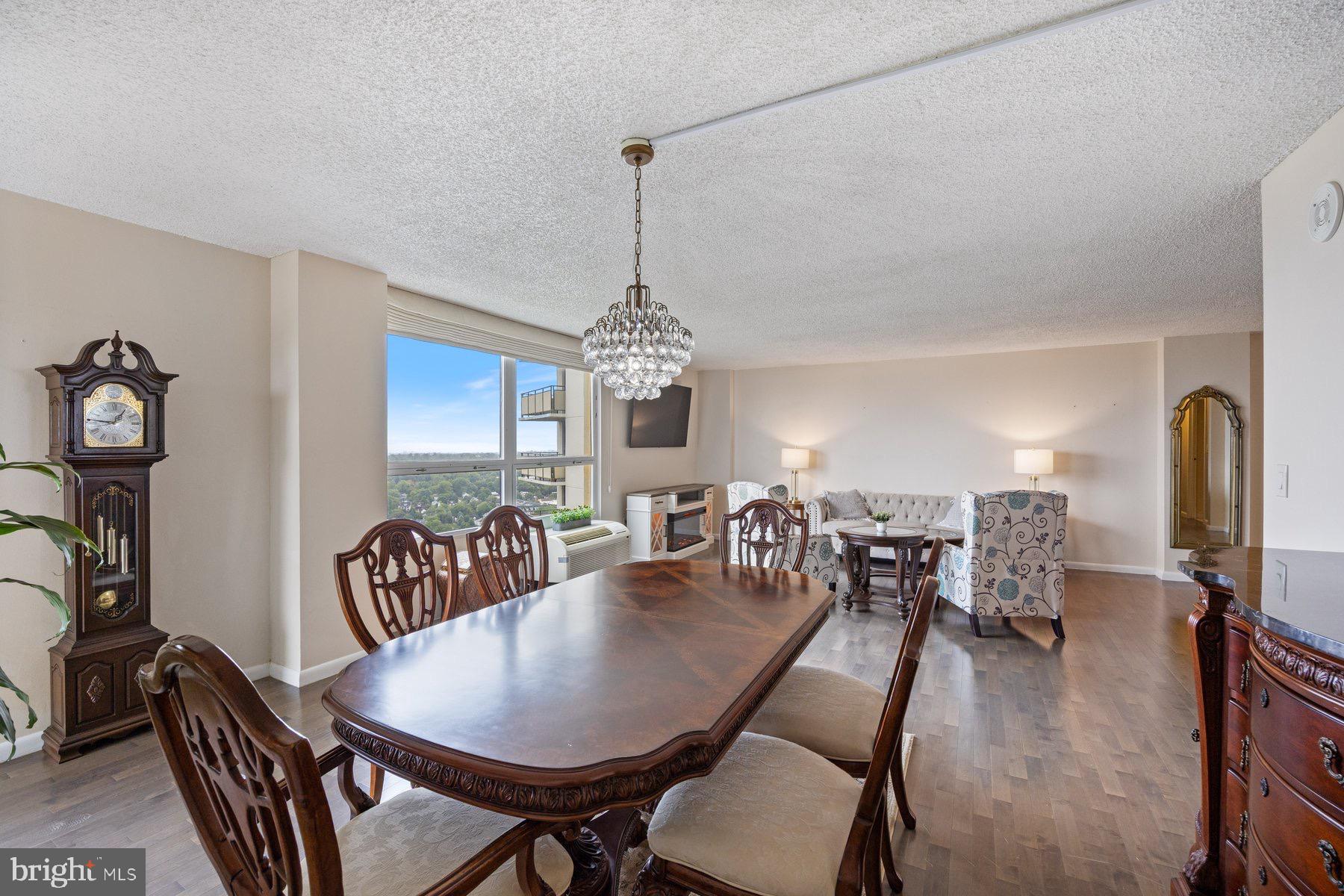 205 East Joppa Road, Unit 2403 Towson, MD 21286 - Photo 48 of 48 a view of a dining room with furniture window and wooden floor