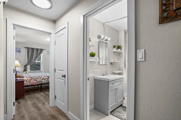 a en suite bathroom with a sink a mirror and a shower