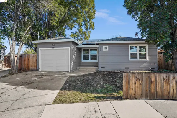 a front view of a house with a garage