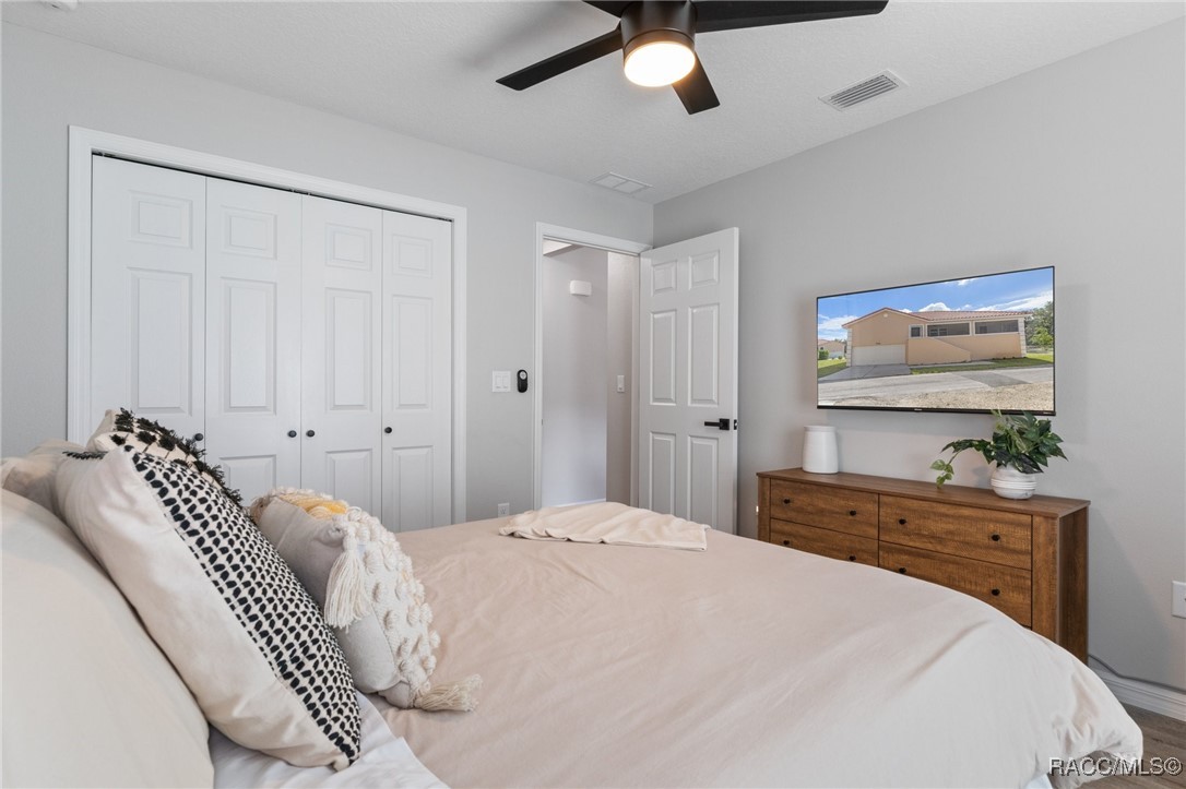 4865 South Tromp Loop Homosassa, FL 34448 - Photo 18 of 30 a bedroom with a bed and a window