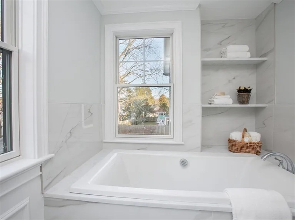 35 Hanson Road, Unit 35 Newton, MA 02459 - Photo 9 of 13 a bathroom with a bathtub and a window