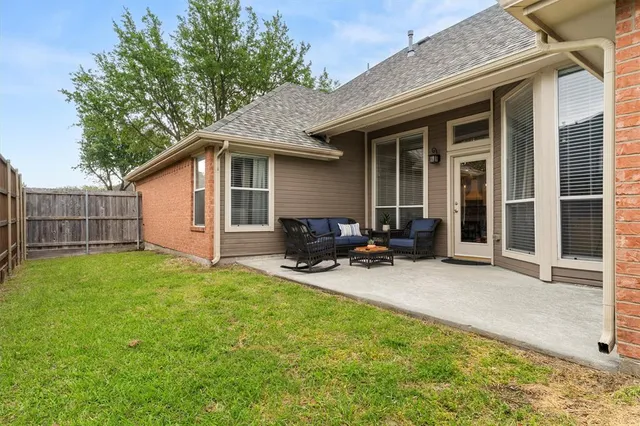 a backyard of a house with seating space