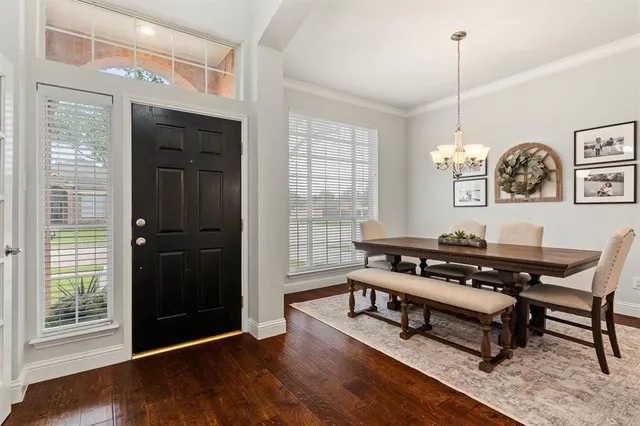 a reading room with furniture a rug and a window