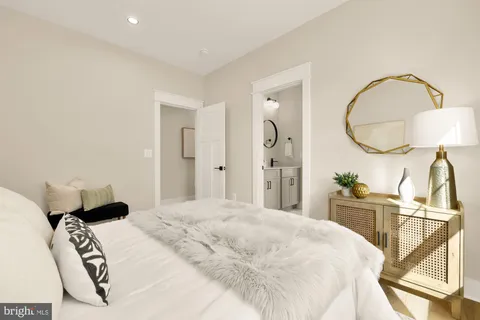 a bedroom with a bed and a lamp