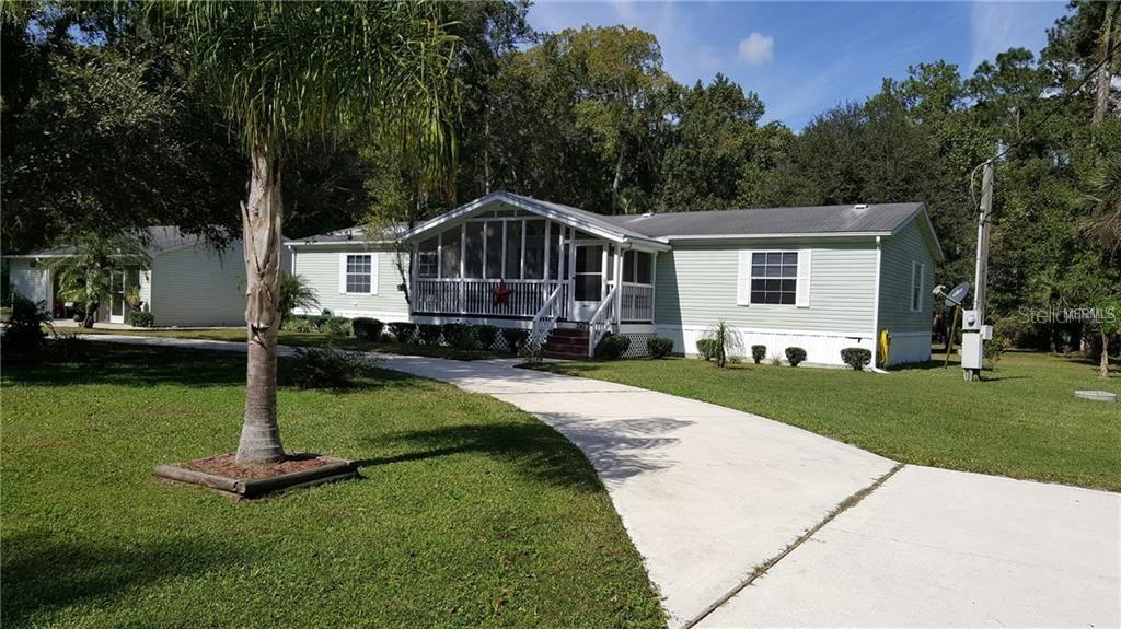 24233 Fox Road Astor, FL 32102 - Photo 1 of 1 Welcome to 24233 Fox Road with circular drive