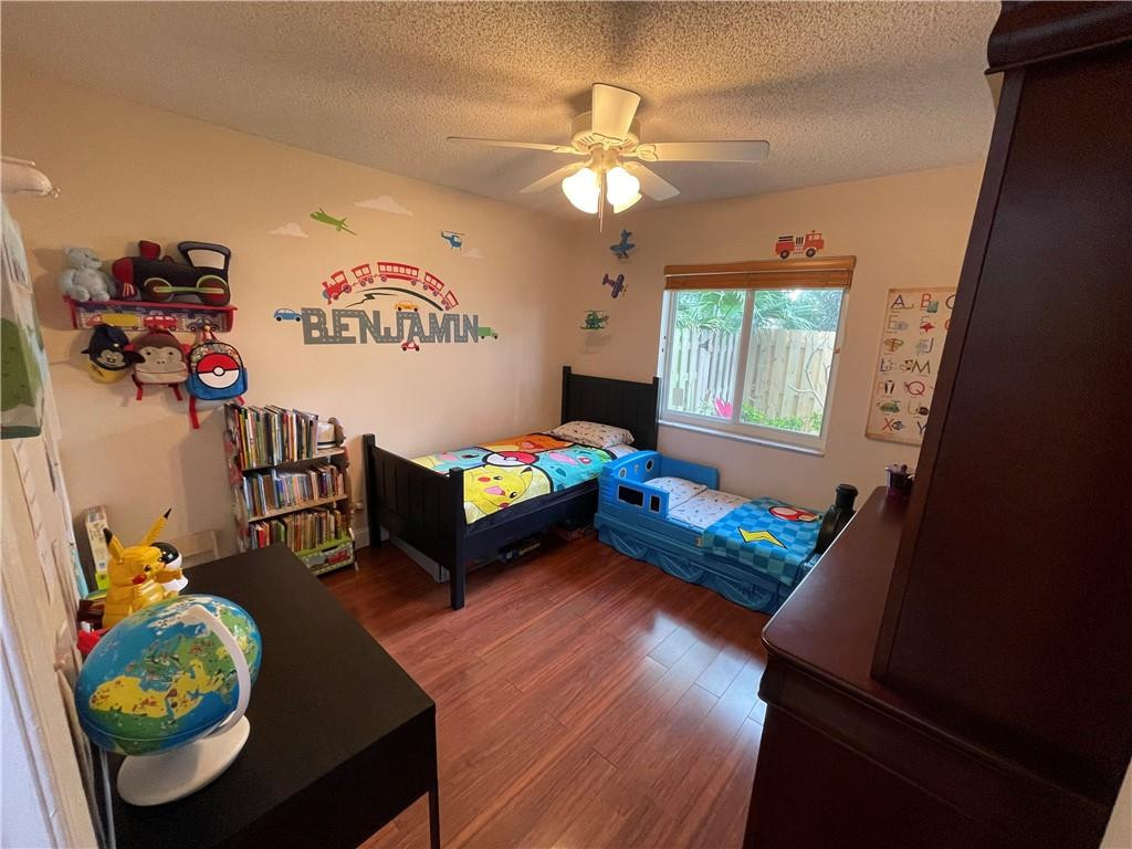 2358 Northwest 31st Street Boca Raton, FL 33431 - Photo 4 of 11 a living room with furniture and a chandelier