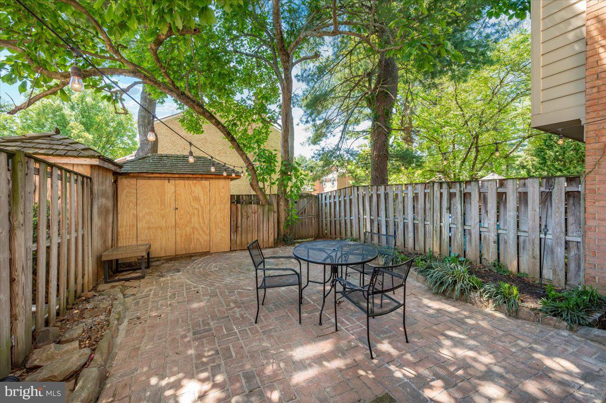 36 Castle Court Gaithersburg, MD 20878 - Photo 32 of 37 Charming patio oasis under leafy trees.