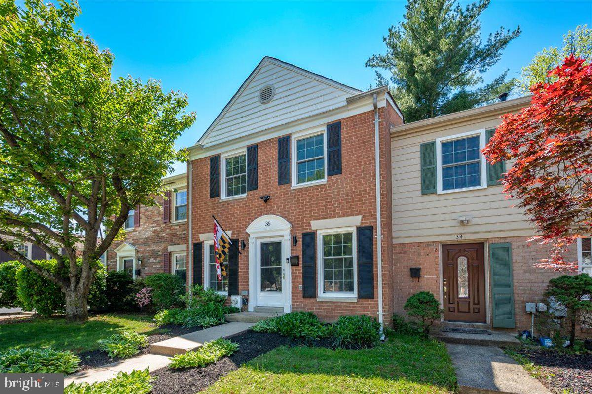 36 Castle Court Gaithersburg, MD 20878 - Photo 35 of 37 Charming brick townhouse with lush greenery.