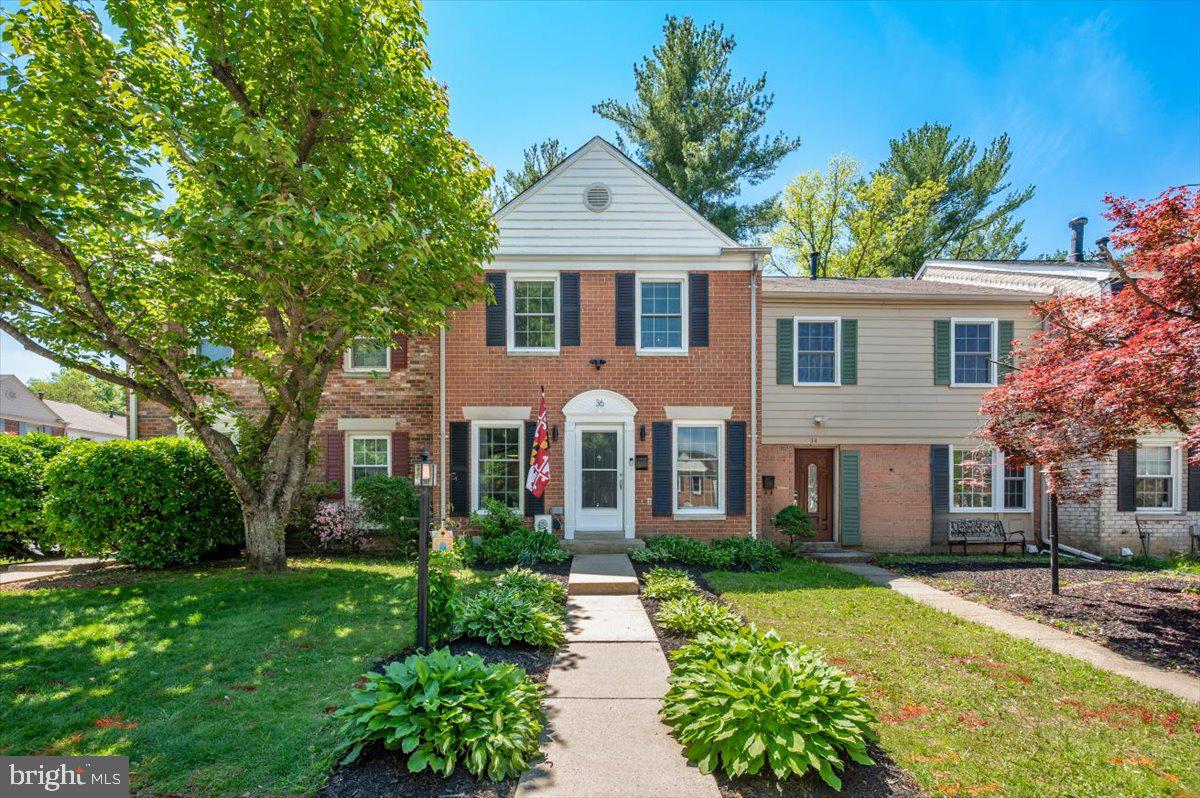 36 Castle Court Gaithersburg, MD 20878 - Photo 36 of 37 Charming brick facade with lush greenery.