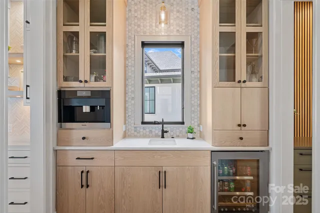 a bathroom with a double vanity sink and mirror