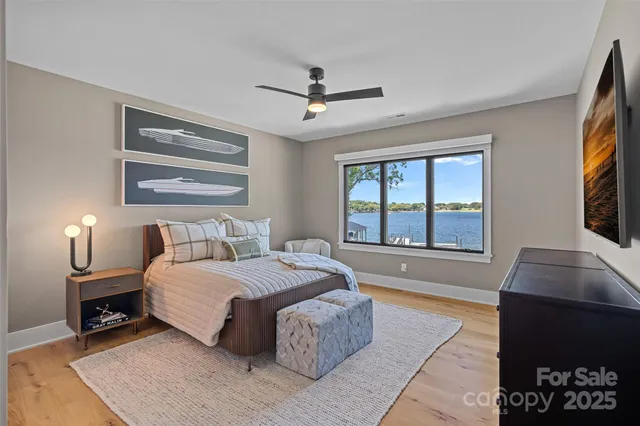 a bedroom with a large bed and a tv