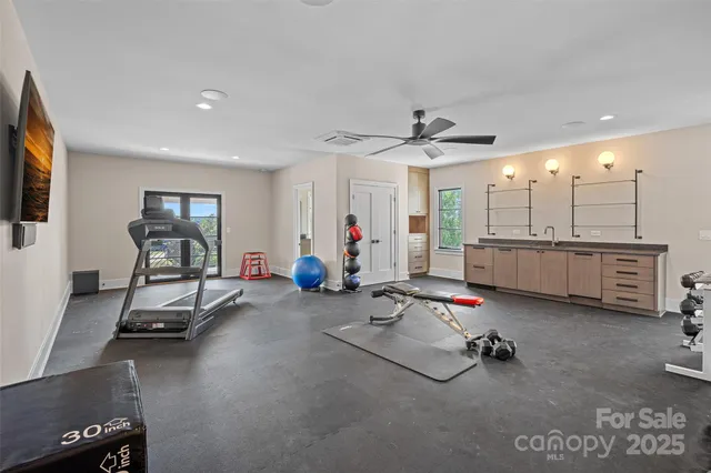 a room with gym equipment and a large window