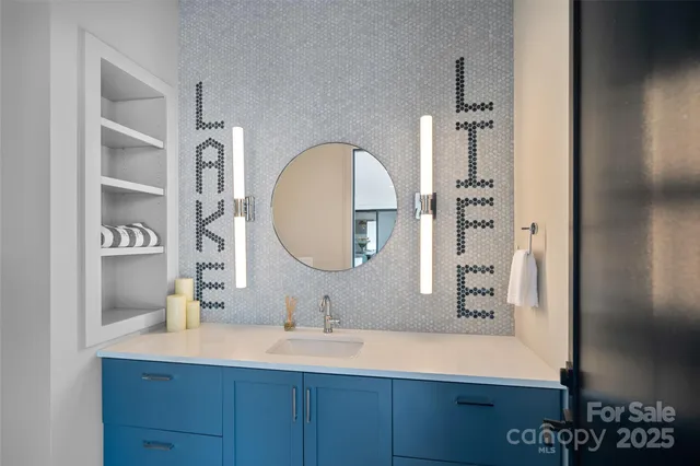 a bathroom with a sink and a mirror