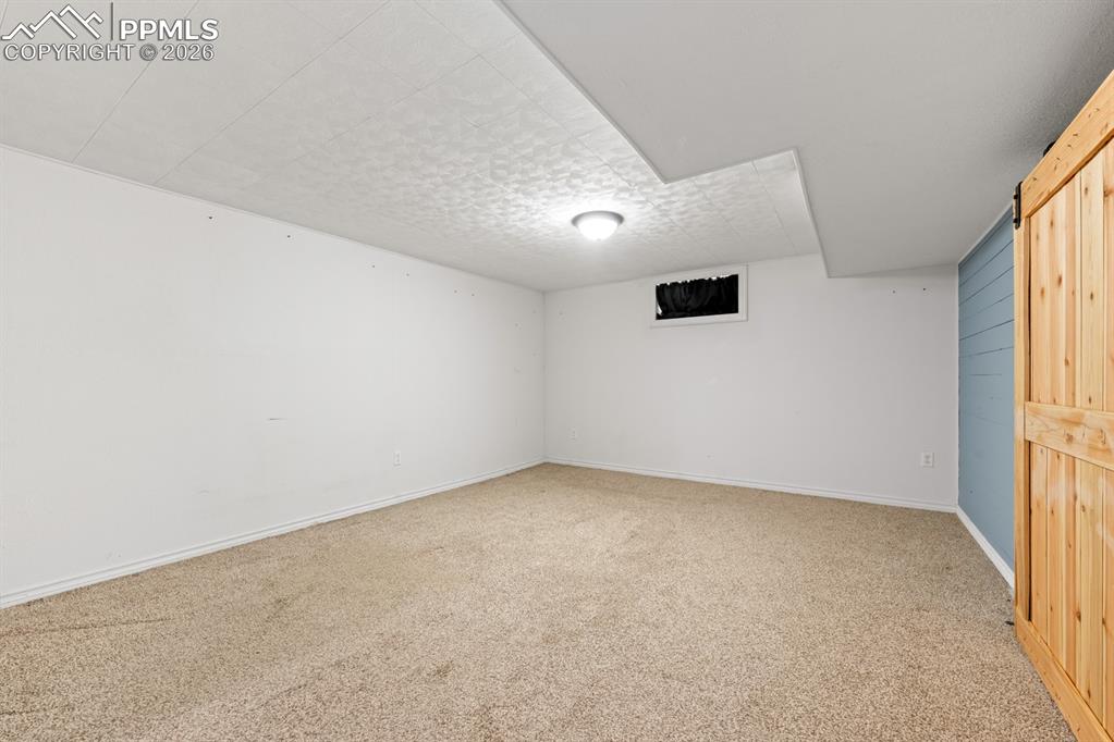 522 Madison Street Pueblo, CO 81004 - Photo 16 of 33 an empty room with windows