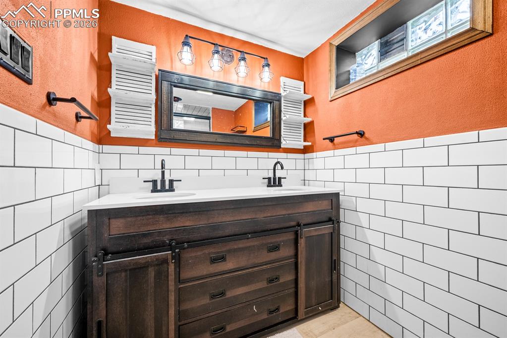 522 Madison Street Pueblo, CO 81004 - Photo 19 of 33 a bathroom with a sink and a mirror
