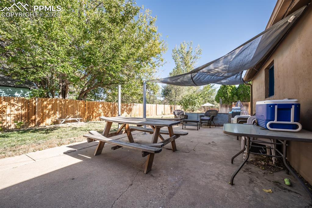 522 Madison Street Pueblo, CO 81004 - Photo 25 of 33 a view of a backyard with sitting area