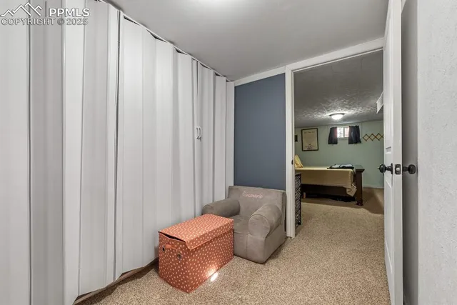 a view of a backyard with sitting area