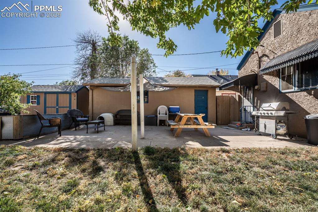 522 Madison Street Pueblo, CO 81004 - Photo 28 of 33 a view of a house with backyard and sitting area
