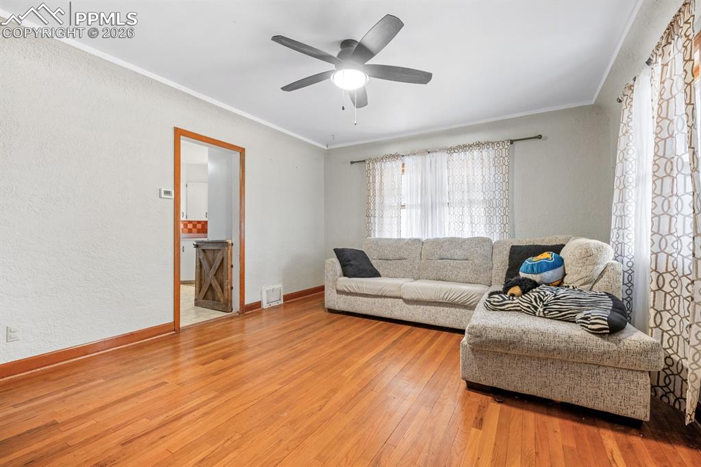 522 Madison Street Pueblo, CO 81004 - Photo 3 of 33 a living room with furniture and wooden floor