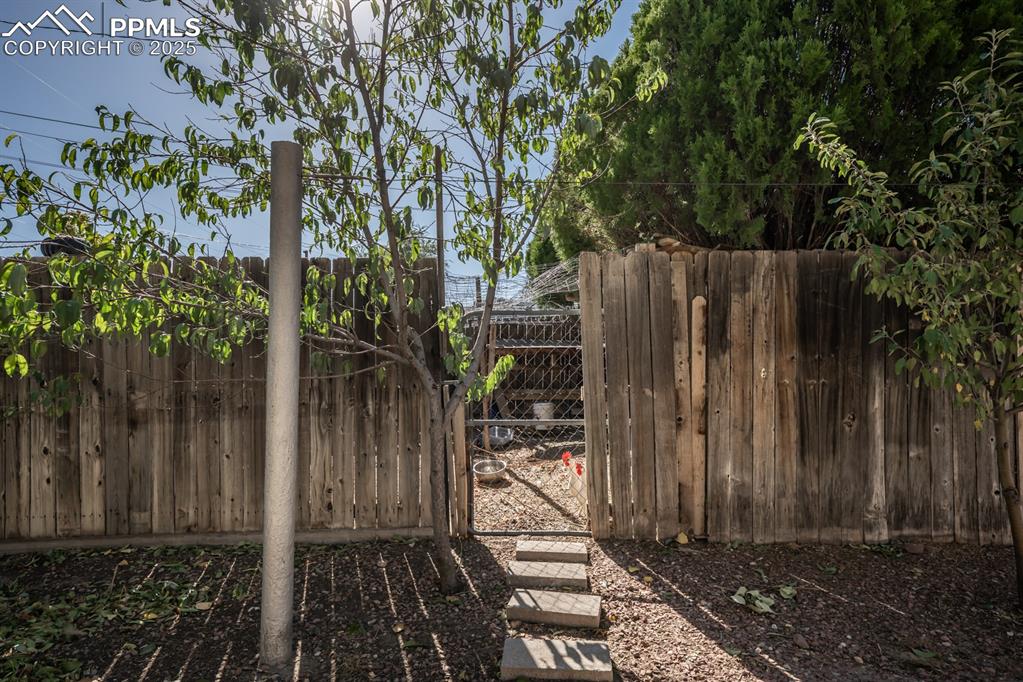 522 Madison Street Pueblo, CO 81004 - Photo 31 of 33 a view of a wooden fence