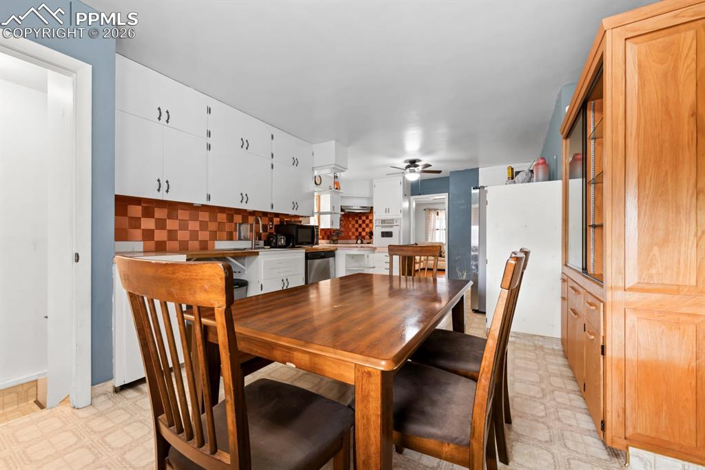 522 Madison Street Pueblo, CO 81004 - Photo 9 of 33 a dining room with furniture and window