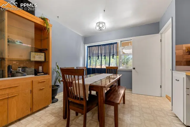 a kitchen with stainless steel appliances kitchen island granite countertop a sink and white cabinets