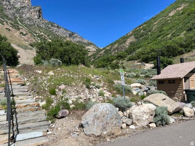 1251 Alpine Way Provo, UT 84606 - Photo 12 of 13 Scenic canyon-view setting with native desert landscaping, mature shrubs, and natural stone hardscaping