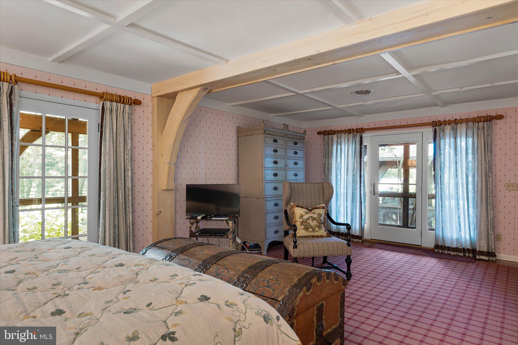 1455 Cayots Corner Road Chesapeake City, MD 21915 - Photo 111 of 141 a bedroom with bed and glass door