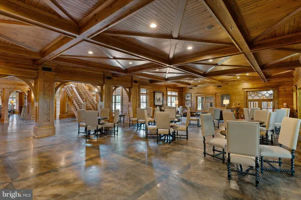 an aerial view of a house with outdoor space and lake view