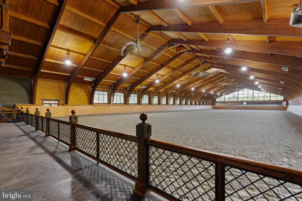 a outdoor kitchen with a stove and a refrigerator