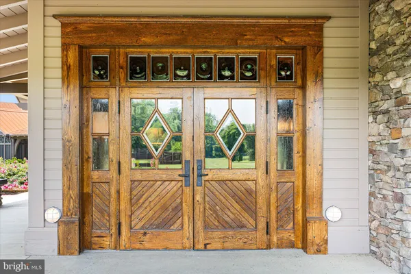 a view of a room with wooden floors and lots of racks